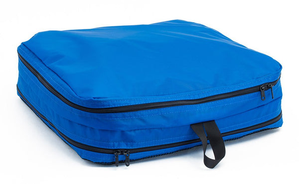 A filled and zipped closed Island (blue) Aether Large Aeronaut 45 Packing Cube all-fabric side up.